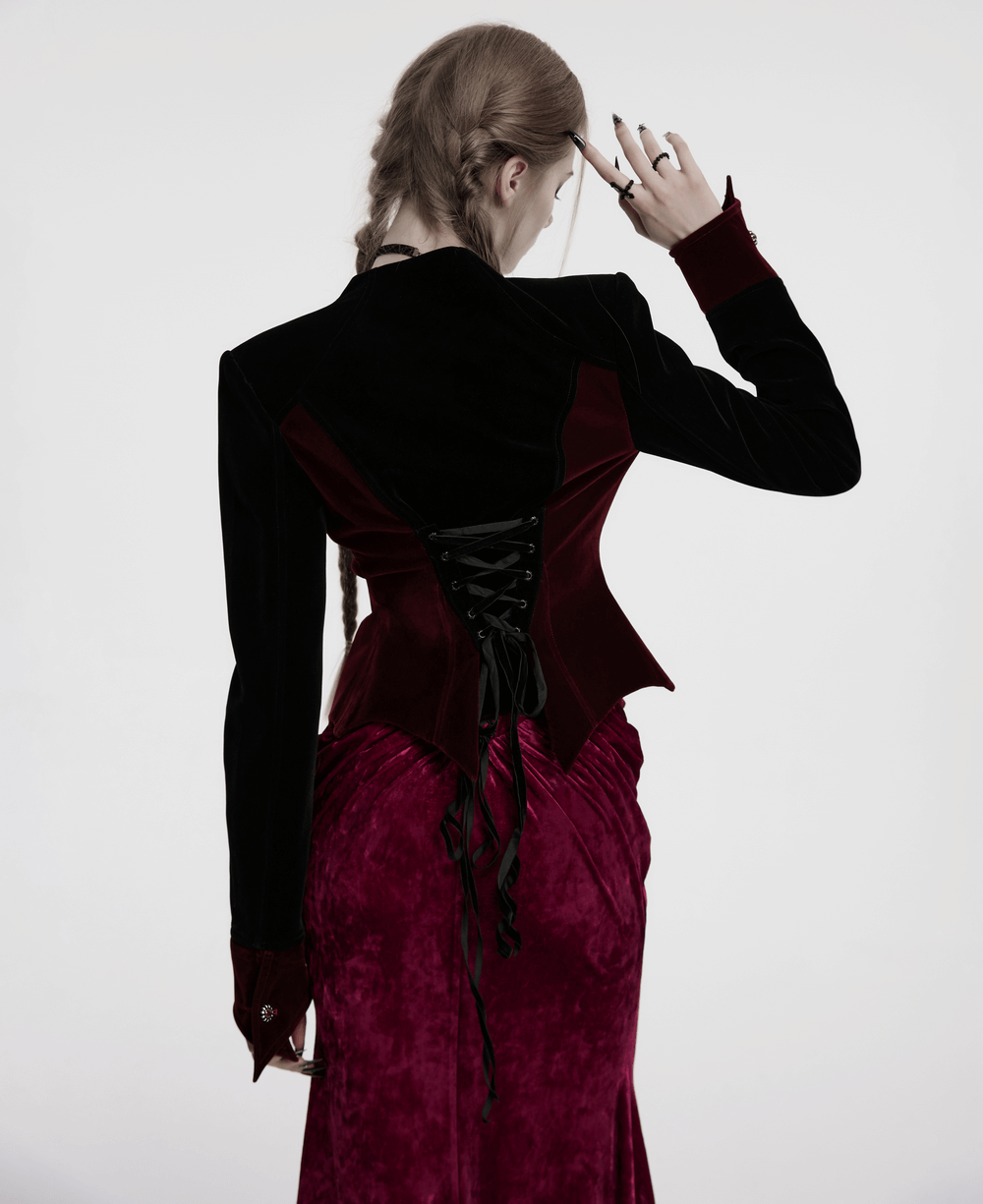 Back view of a velvet gothic jacket with lace-up detail, showcasing the bat hem and elegant silhouette.