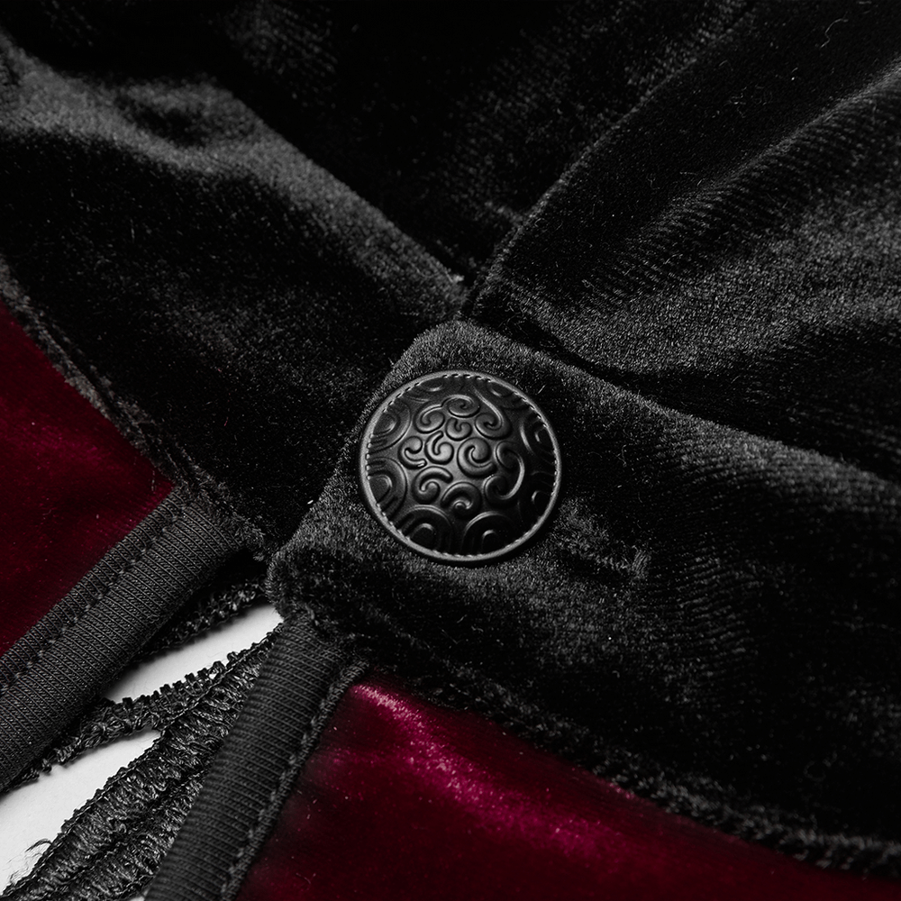 Close-up of elegant black velvet with intricate hand-sewn water-drop buckle detail for gothic dress.