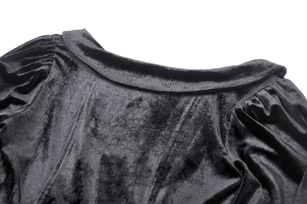 Close-up of the luxurious black velvet fabric and elegant neckline of a gothic dress. Perfect for adding a touch of Victorian charm.