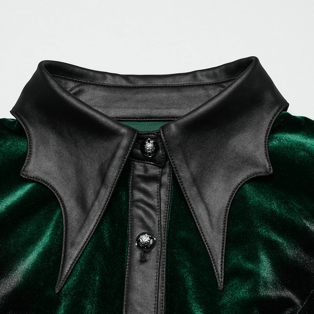 Close-up of velvet shirt's bat collar and floral buttons in gothic style, showcasing rich green gradient design.