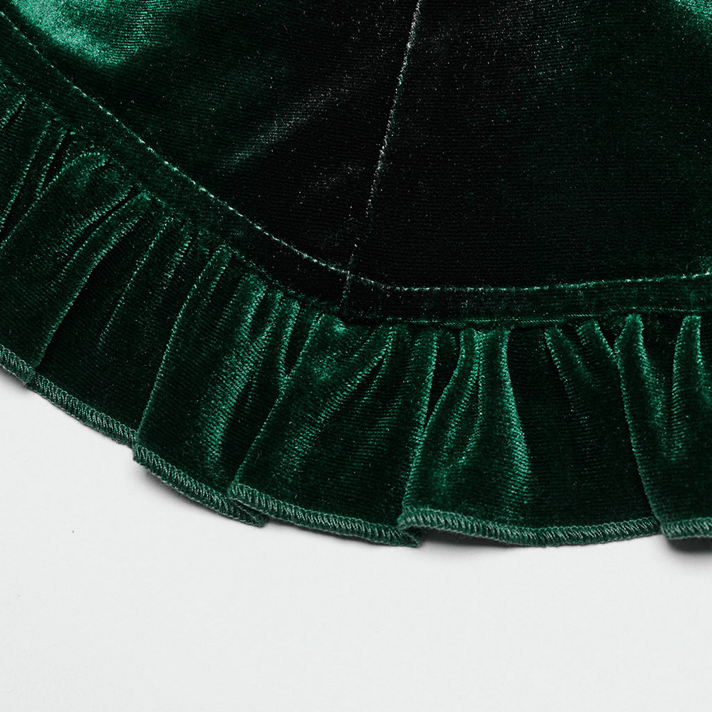 Close-up of soft green velvet ruffles, highlighting the elegant design of a gothic shirt with dramatic flair.