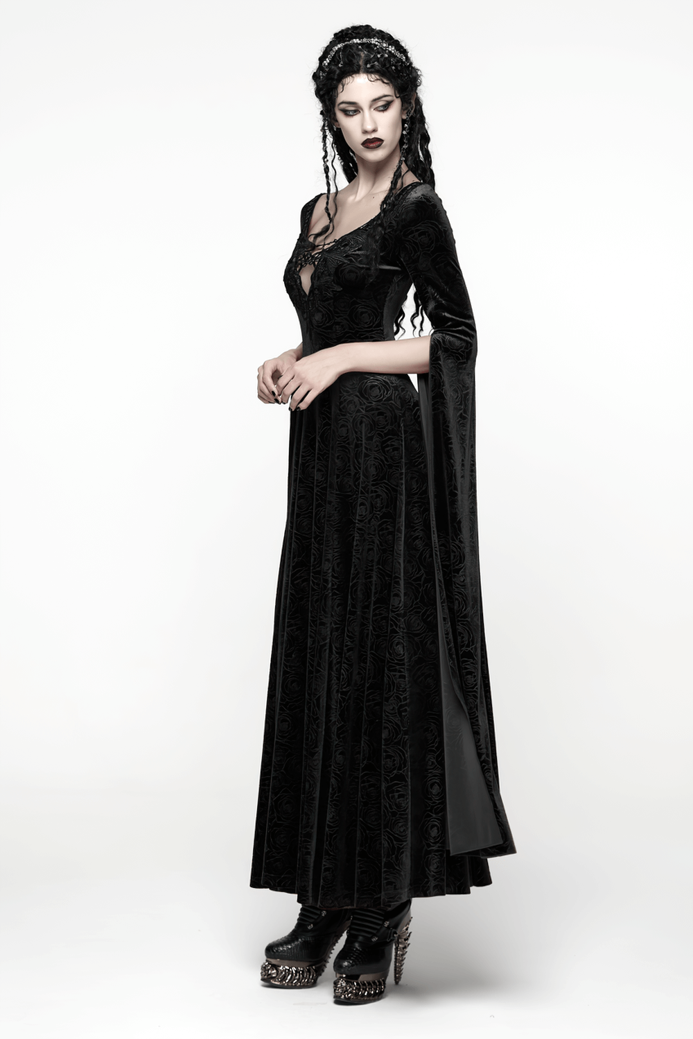 Elegant model showcasing a Velvet Long Dress with Gem Appliqué and Flared Sleeves in dark gothic style.