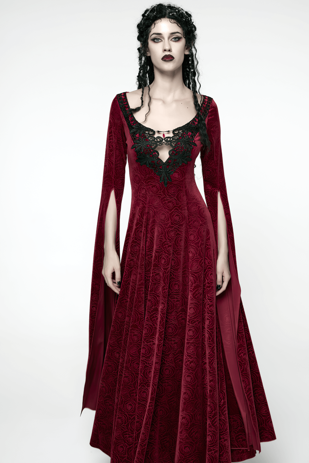 Velvet Rose Gothic Maxi Dress with Flowing Sleeves showcasing a model in a dramatic red velvet dress with flowing sleeves.