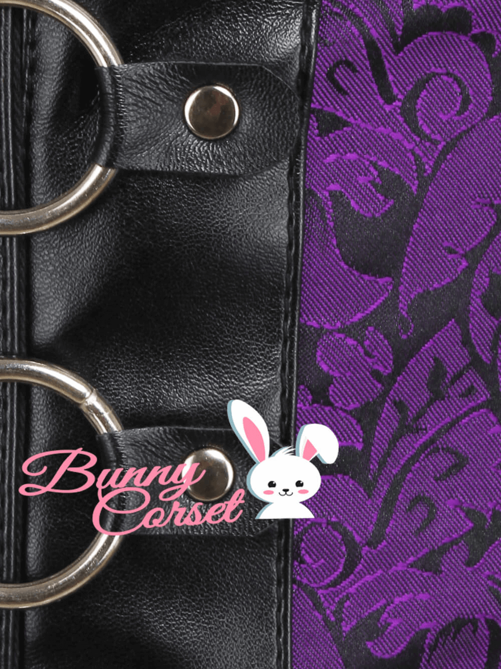 Close-up of a black faux leather corset belt with purple floral pattern and metal rings, showcasing style and support.