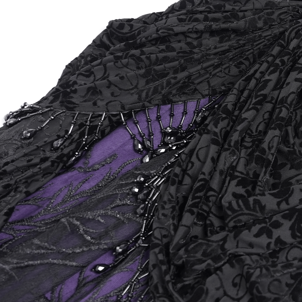 Close-up of gothic black and purple lace skirt showing beaded fringe and floral patterns, perfect for Victorian dark fashion.