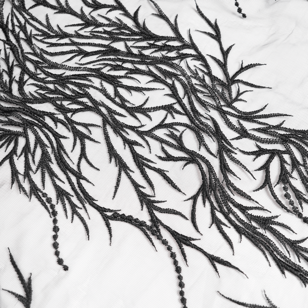 Elegant black embroidery on white fabric, featuring intricate floral and leafy designs perfect for gothic fashion.