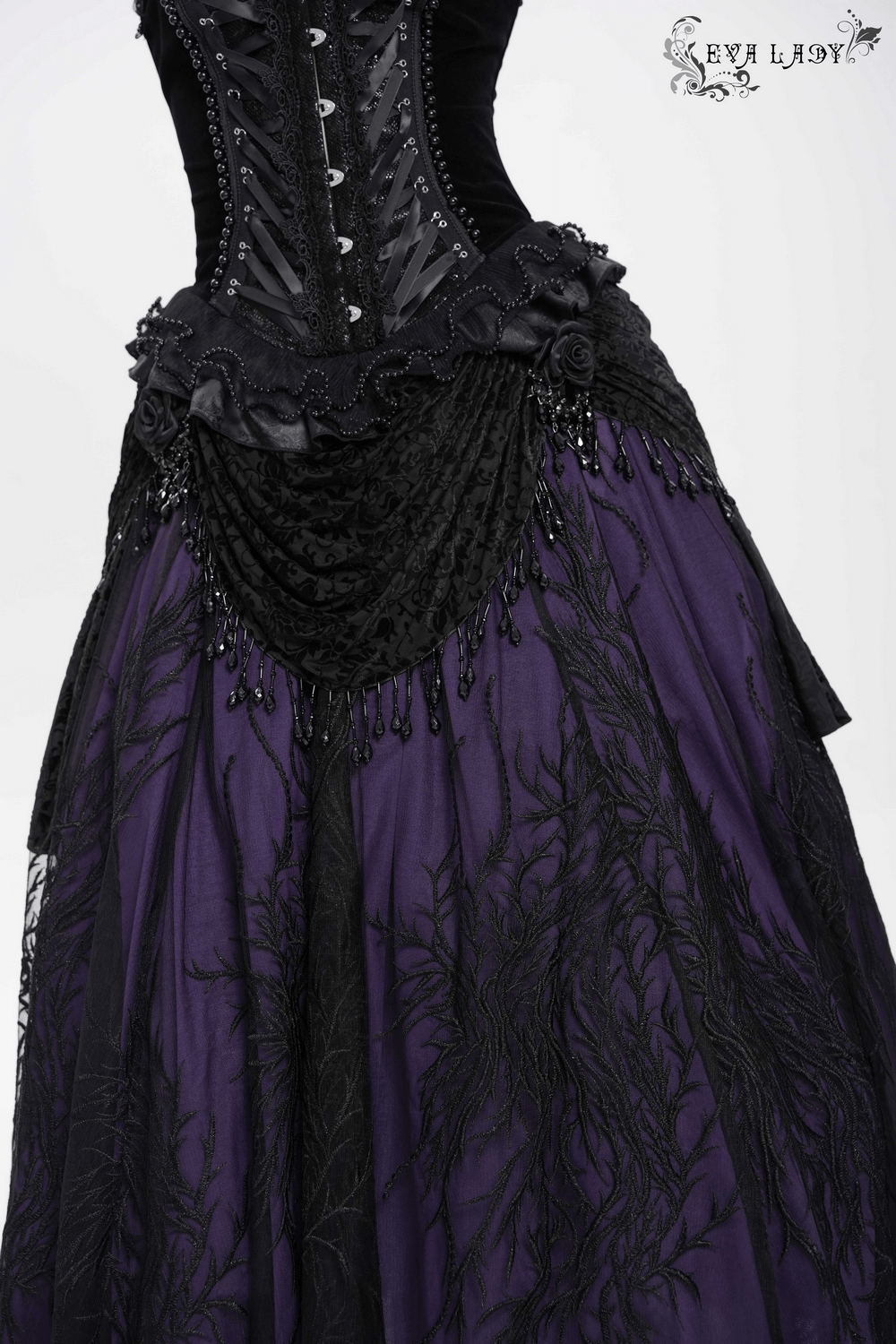 Victorian beaded overlay skirt with floral appliqué, featuring black lace, velvet draping, and a deep purple base.