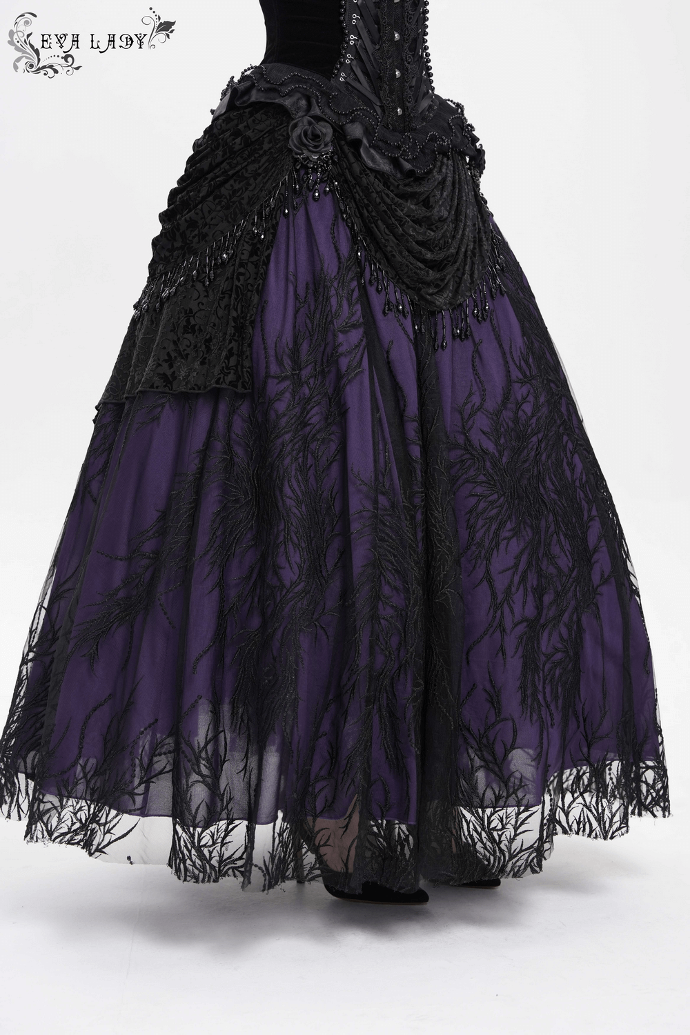 Gothic Victorian beaded overlay skirt in deep purple with black lace and velvet draping, perfect for dark fashion.