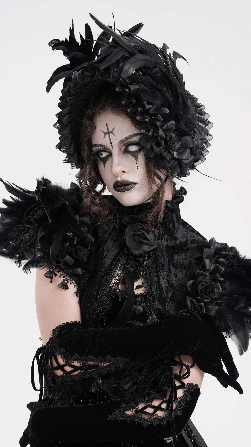 Elegant model wearing a Victorian black feather bonnet with ruffled trim and dramatic makeup, perfect for gothic fashion.