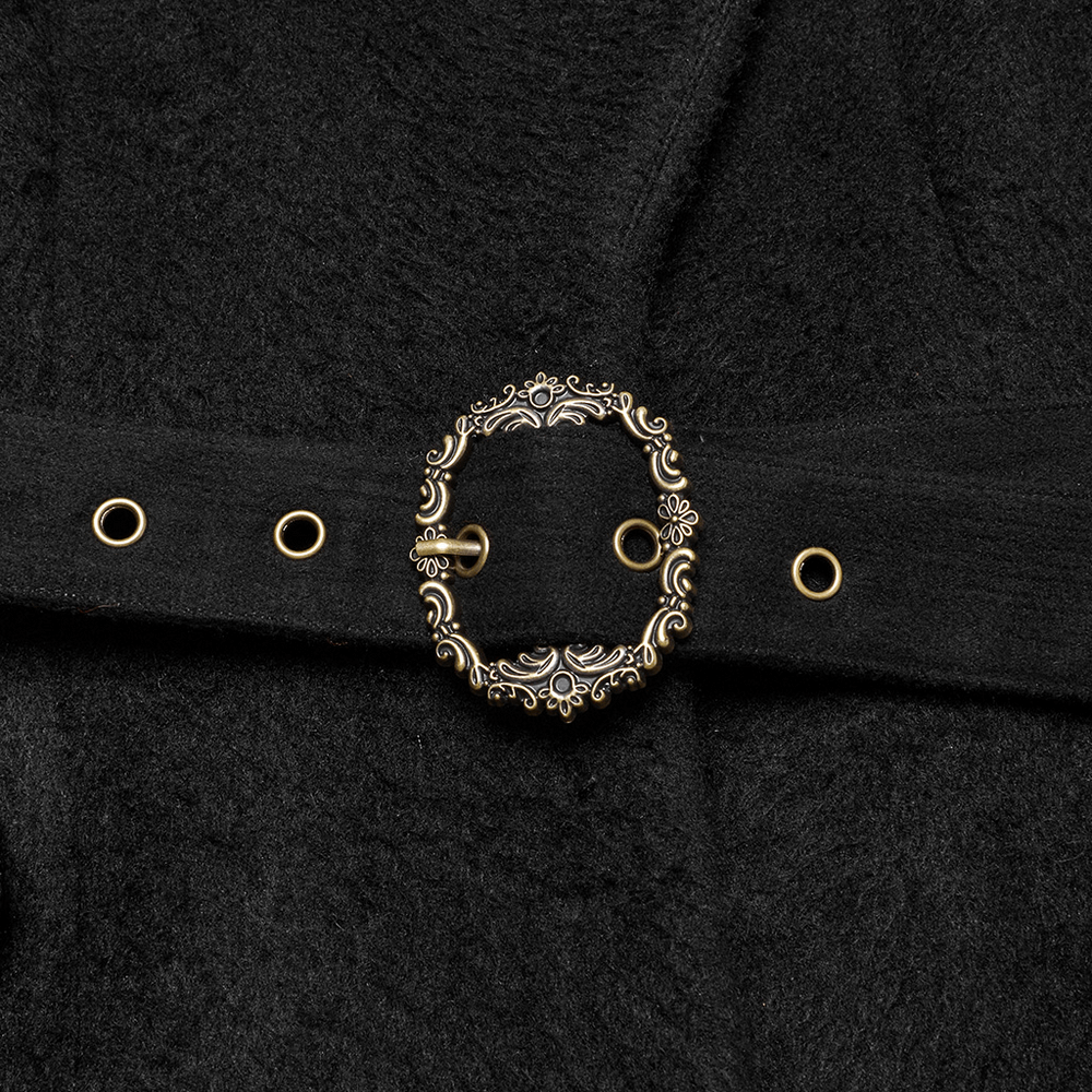 Close-up of ornate black belt buckle with vintage floral design, perfect for Victorian gothic style coats.