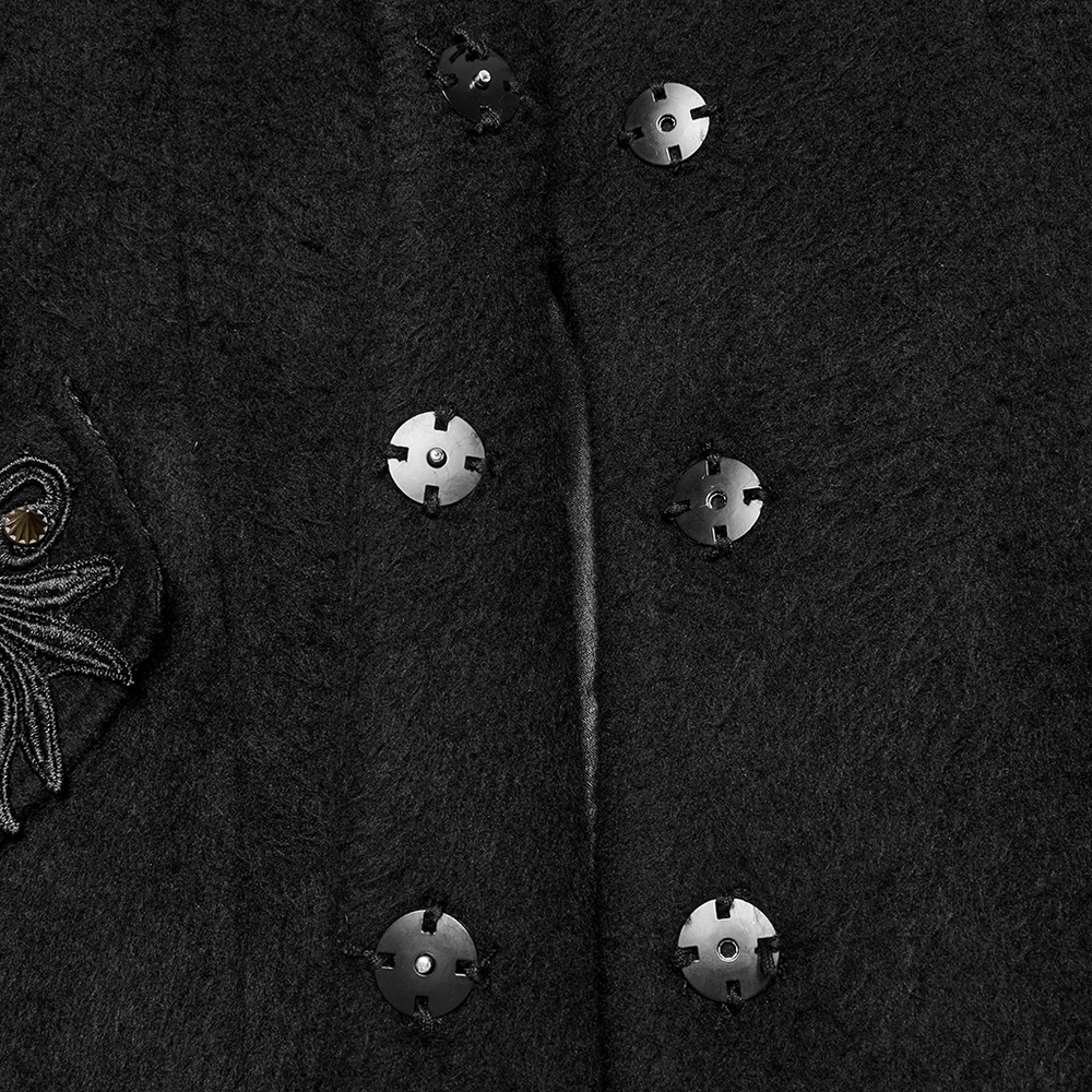 Close-up of ornate buttons on a Victorian black coat with baroque appliques and gothic detailing.