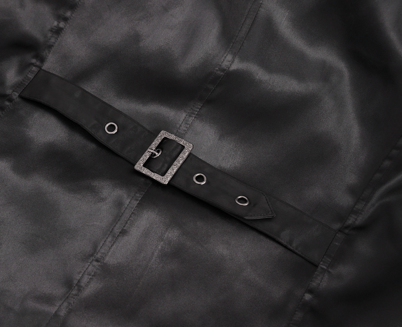 Close-up of a sleek black belt buckle on luxurious fabric, showcasing modern elegance and refined craftsmanship.