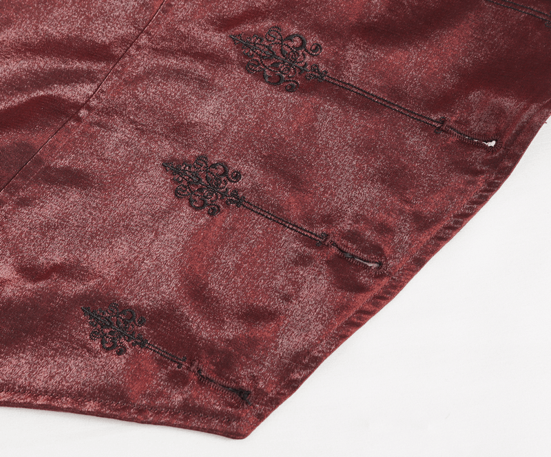Intricate black embroidery on rich burgundy fabric of a Victorian-style waistcoat.