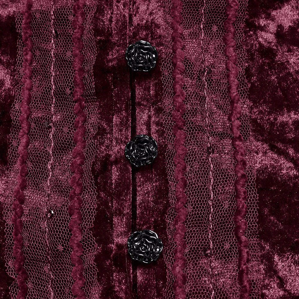 Close-up of burgundy velvet shirt with lace and black rose buckles, showcasing intricate gothic design.