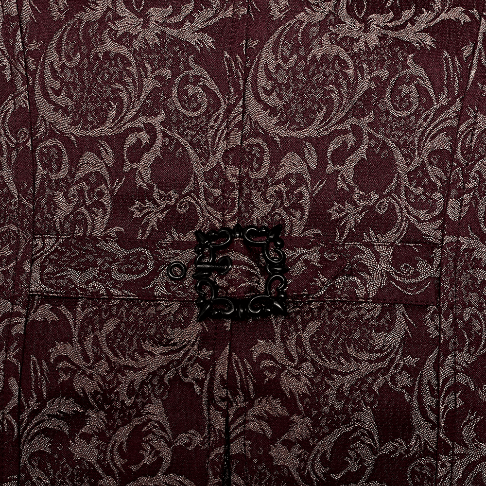 Close-up of Victorian Goth waistcoat with intricate jacquard pattern and vintage hand-sewn button detailing.