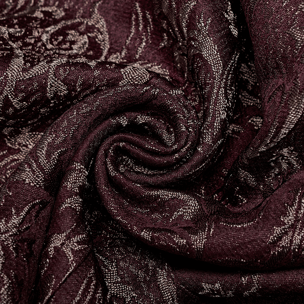 Close-up of rich burgundy jacquard fabric showcasing intricate 3D patterns for a Victorian Goth waistcoat.
