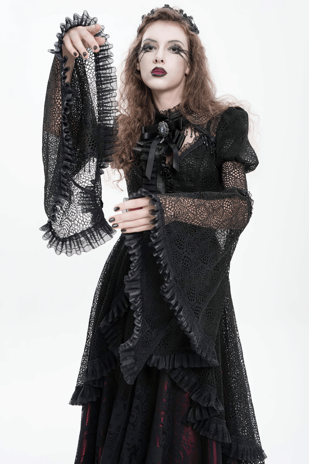 Victorian Elegant Lace Cape with Embellishments worn by model showcasing flowing sleeves and ruffled layers.