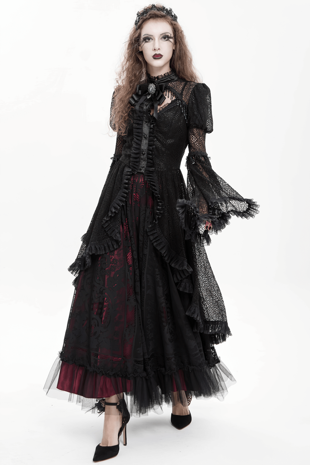 Victorian Elegant Lace Cape with Embellishments worn by model in a dramatic Gothic setting.