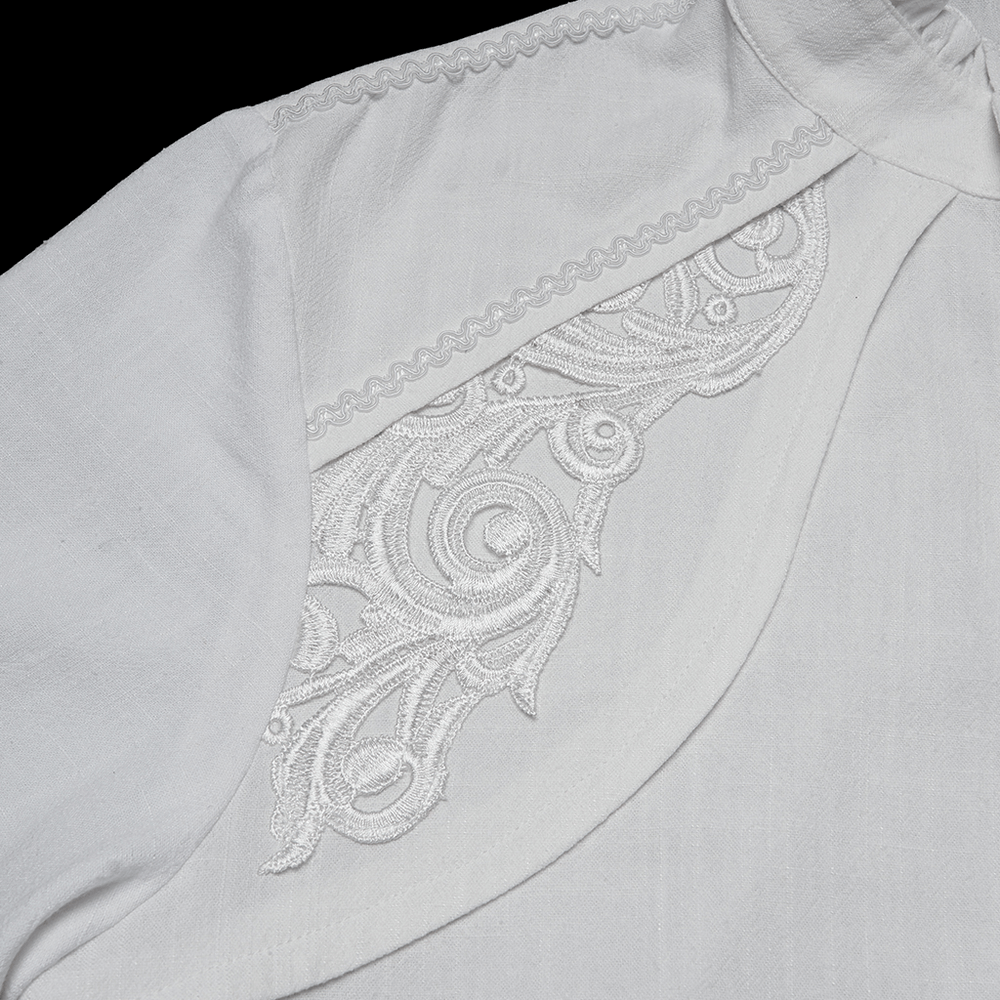 Detail of the Victorian Embroidered White Shirt with Puff Sleeves showcasing elegant white embroidery design.