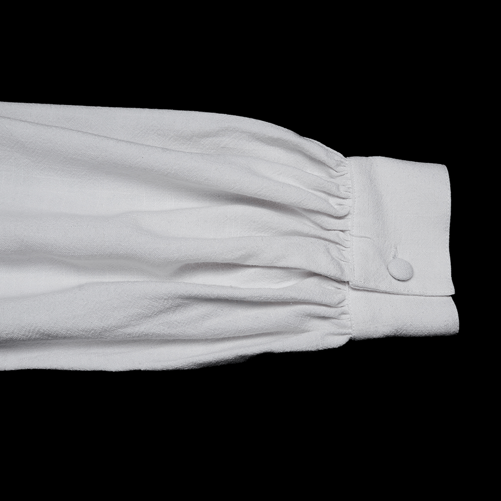 Victorian Embroidered White Shirt with Puff Sleeves close-up of sleeve detail showcasing fabric and cuff design.