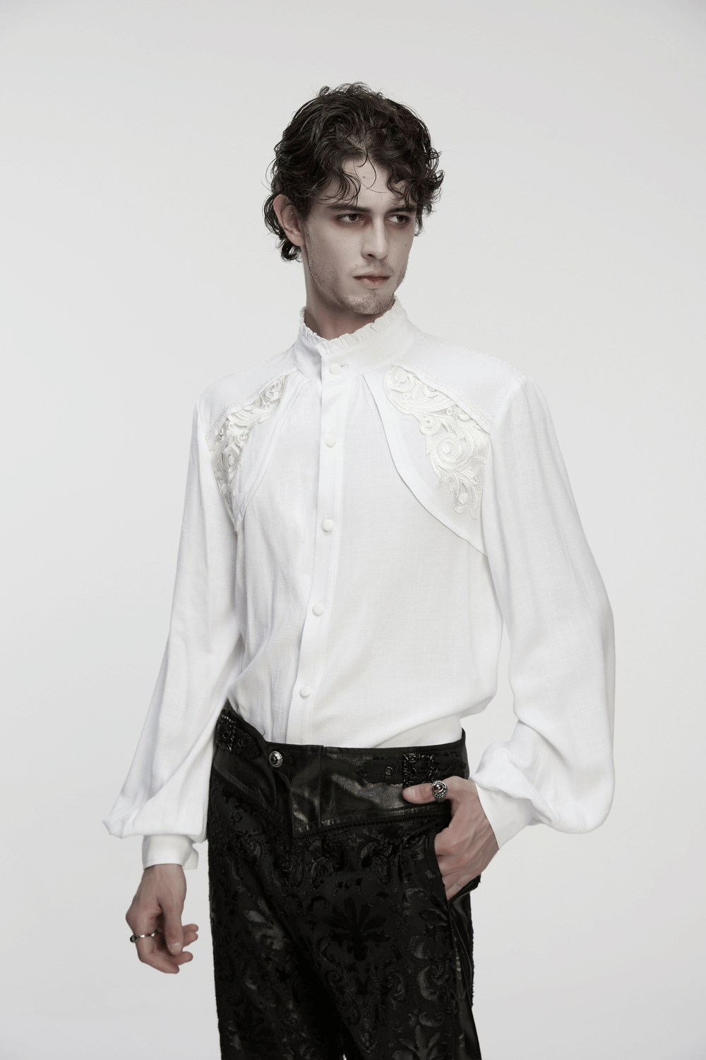 Victorian Embroidered White Shirt with Puff Sleeves worn by model, showcasing intricate details and stylish puffed design.