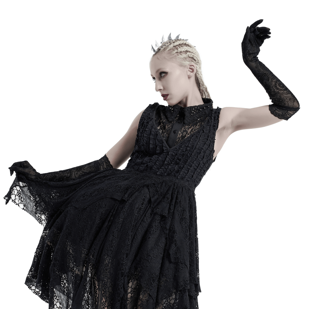 Elegant model in black lace gloves and gothic dress showcasing Victorian style and sophistication.