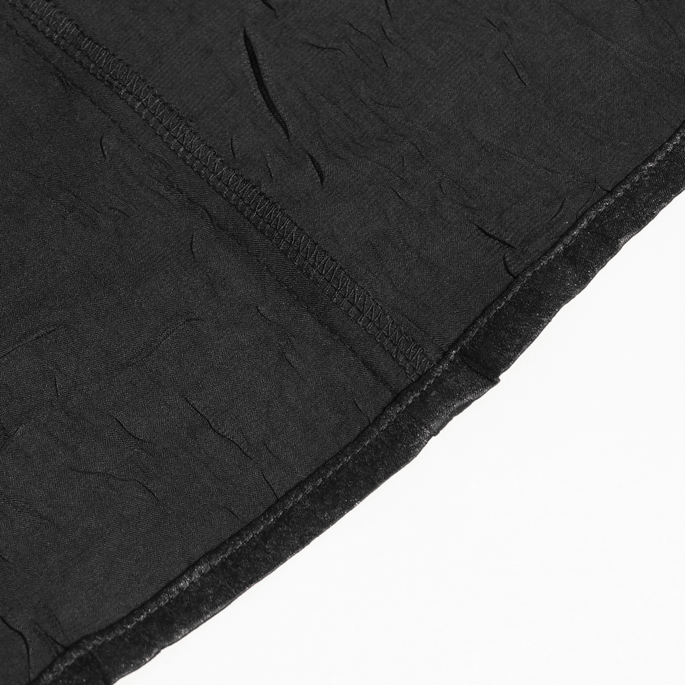 Close-up of the textured fabric of the Victorian Goth Button Shirt With Cameo and Cross Brooch in black.