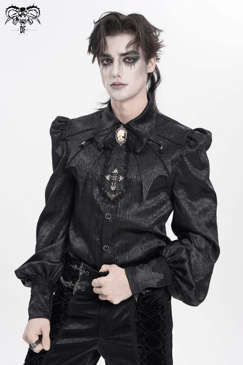 Victorian Goth Button Shirt With Cameo and Cross Brooch modeled by a male model in dark gothic attire.
