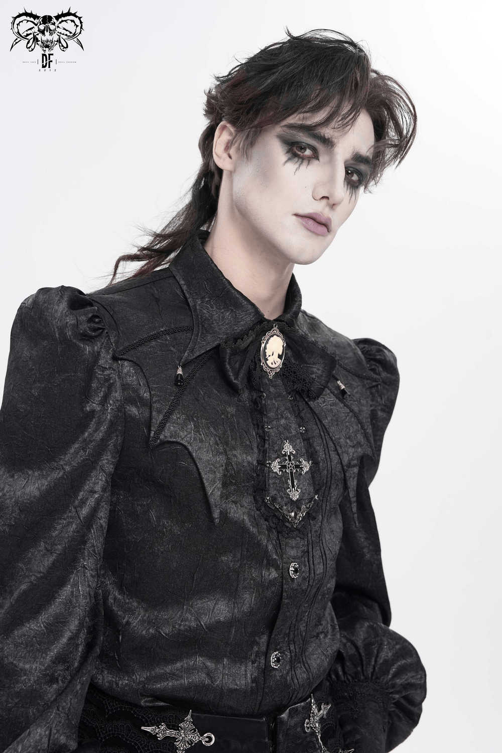 Victorian Goth Button Shirt With Cameo and Cross Brooch worn by a model showcasing its gothic style and bat details.