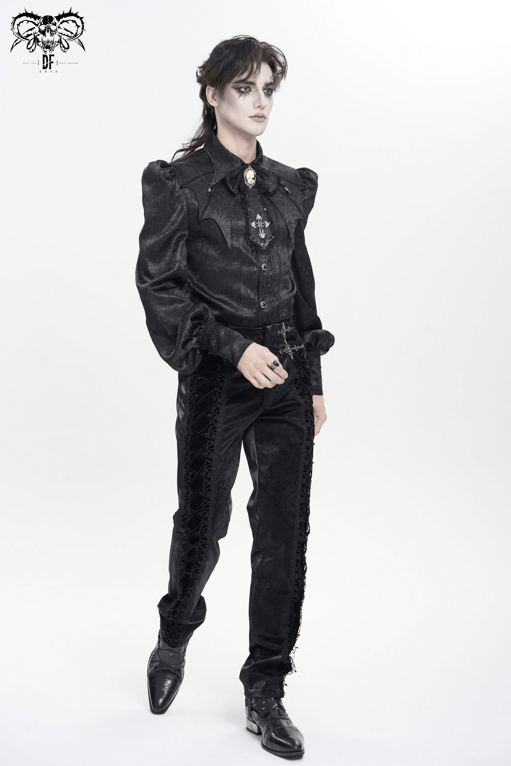 Victorian Goth Button Shirt With Cameo and Cross Brooch worn by a model with puff sleeves and bat details.