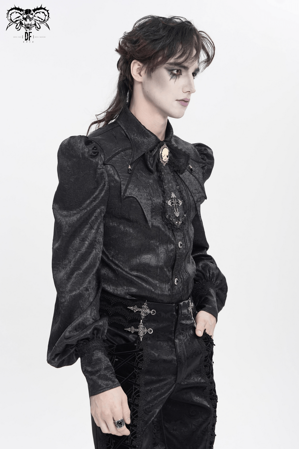 Victorian Goth Button Shirt With Cameo and Cross Brooch showcased on a model with dramatic puff sleeves.