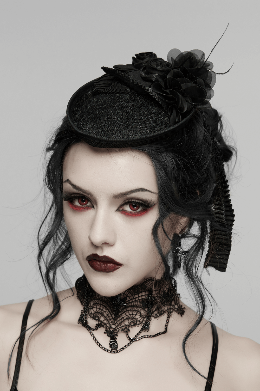 Victorian Goth Rose Fascinator Hat with Ribbon Clip worn by a model with gothic makeup and attire.