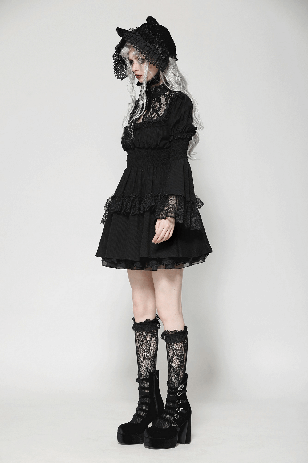 Elegant Victorian Gothic black lace dress with ruffles, bell sleeves, and stylish lace boots for gothic fashion lovers.