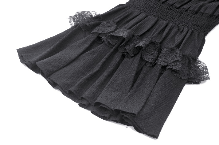 Close-up of Victorian Gothic black lace dress showcasing ruffled details and elegant tiered skirt.