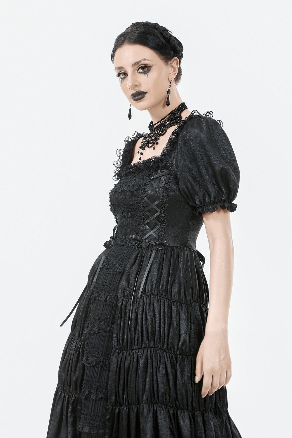 Victorian Gothic Black Puff-Sleeved Long Dress featuring puff sleeves, lace-up corset, and dramatic ruffles.