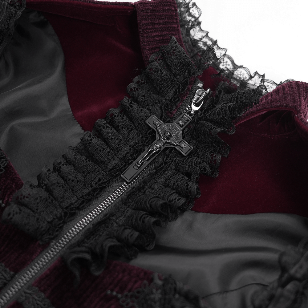 Close-up of a gothic burgundy corset blouse zipper with lace accents and a decorative cross pull.