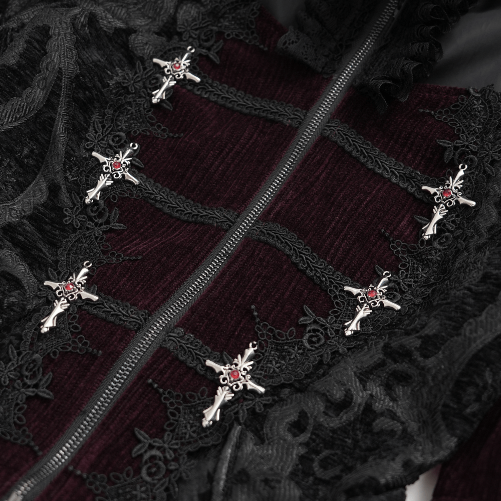 Victorian gothic blouse with lace accents and decorative metal embellishments close-up.