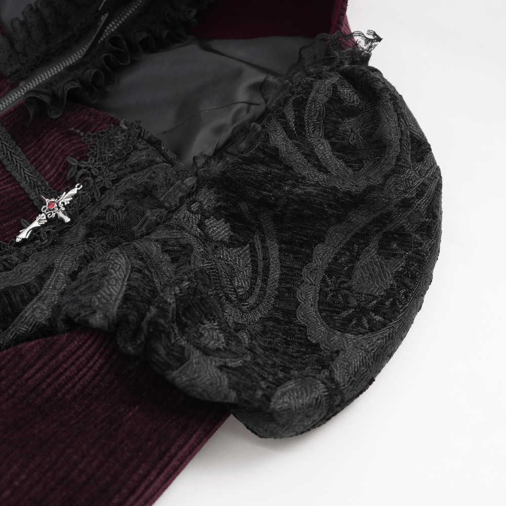 Close-up of black lace detailing on a Victorian Gothic blouse with bell sleeves, featuring intricate floral designs.