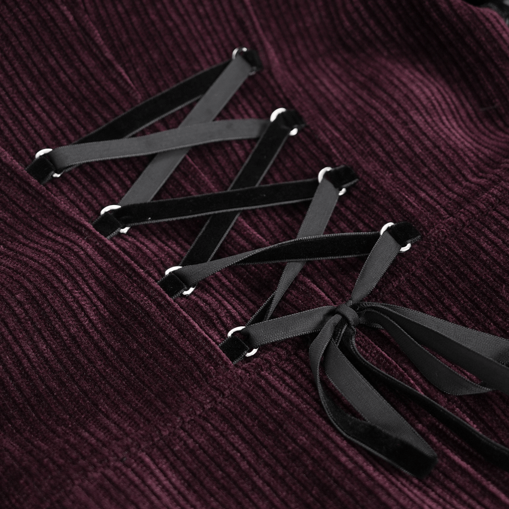 Close-up of burgundy cord lacing on a Victorian gothic blouse, showcasing elegant texture and design details.