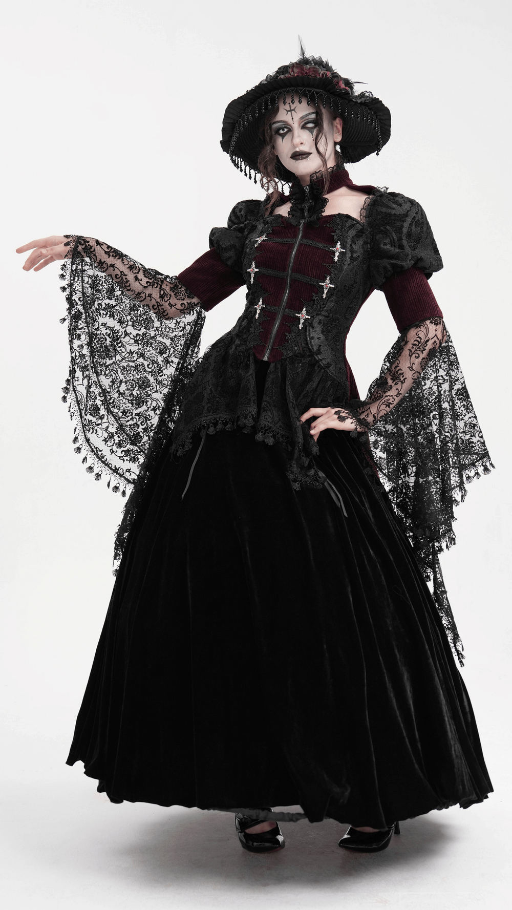 Victorian Gothic blouse with bell sleeves, lace accents, and steampunk flair worn by model in a dramatic pose.