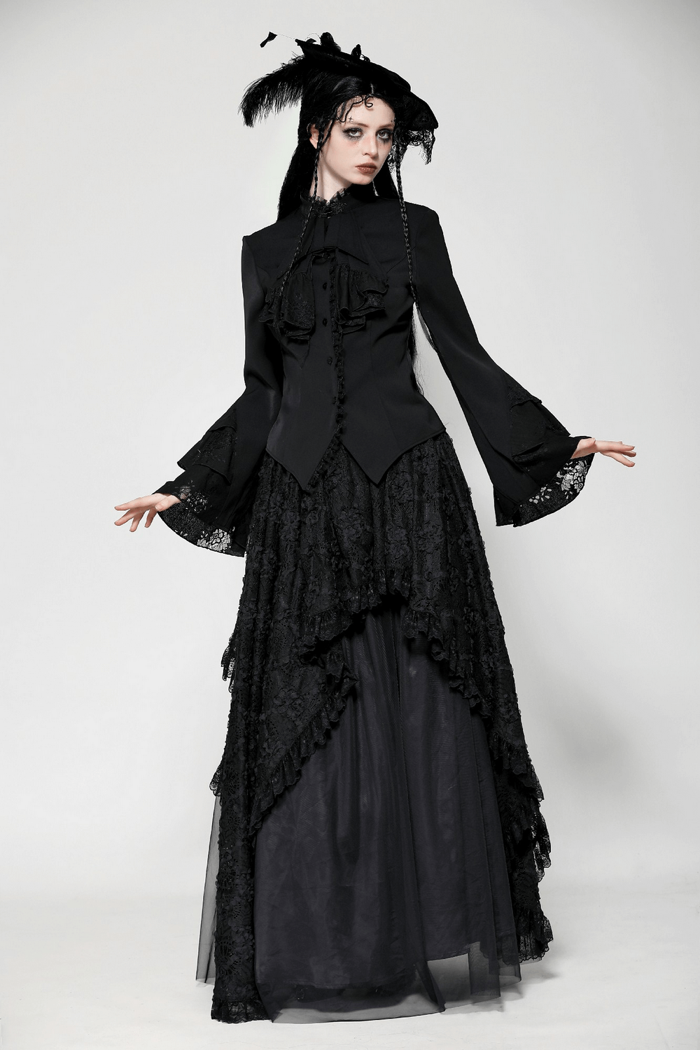 Elegant model wearing a Victorian Gothic blouse with lace and ruffle sleeves, perfect for alternative fashion styles.