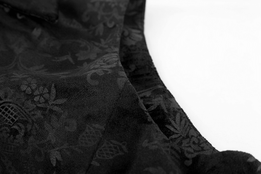 Close-up of luxurious black velvet waistcoat with intricate dark floral prints, showcasing Victorian gothic elegance.