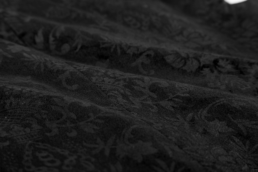 Intricate dark patterned fabric showcasing the luxurious texture ideal for a Victorian Gothic waistcoat.