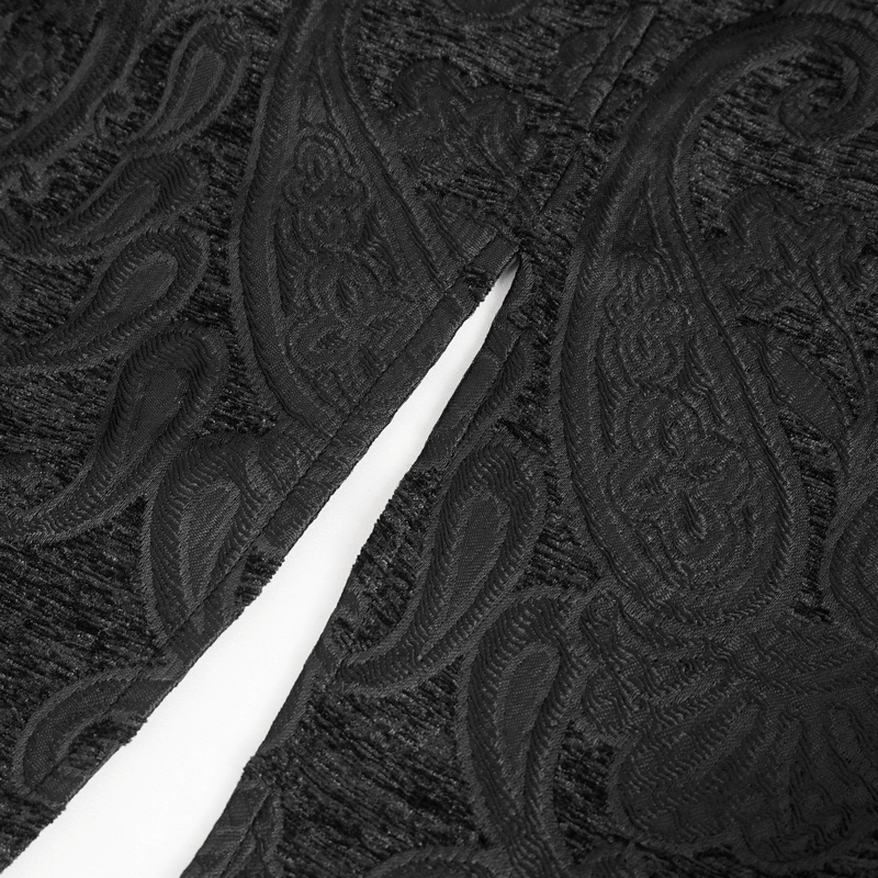 Close-up of intricate black embroidery on Victorian Gothic jacket, showcasing elegant paisley design and tailored details.