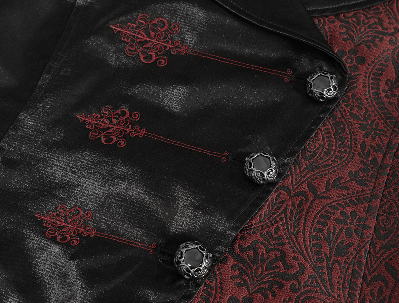 Close-up of a black Victorian gothic waistcoat with intricate red embroidery and ornate buttons.