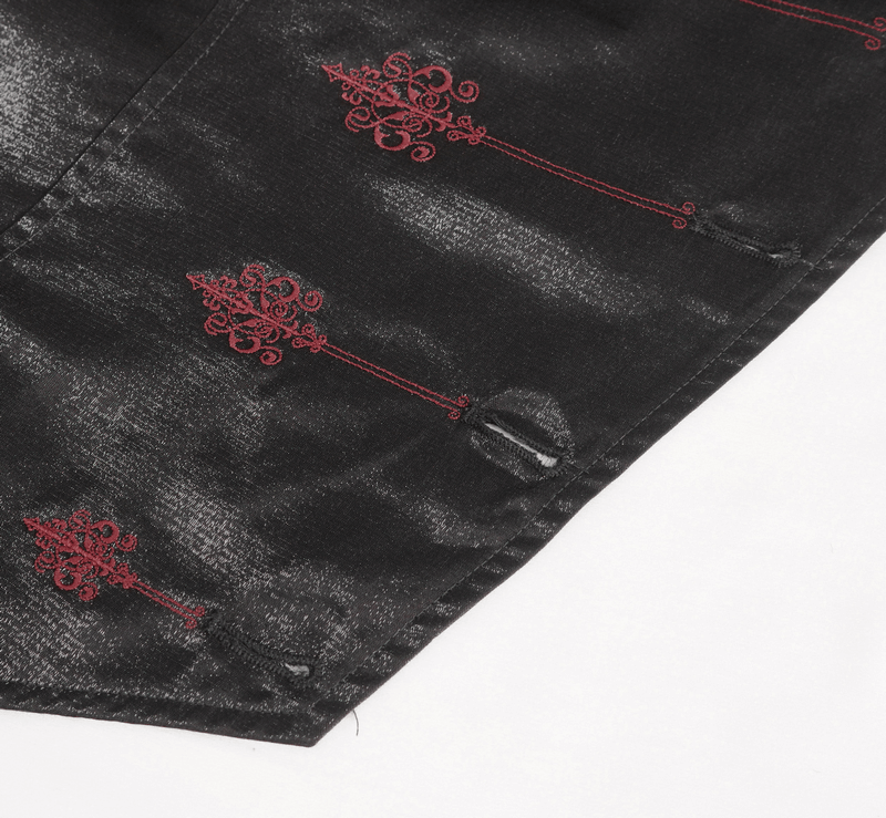 Close-up of intricate red embroidery on black Victorian Gothic embroidered waistcoat jacket for men.