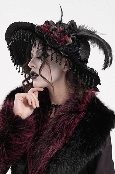 Elegant Victorian Gothic feather hat with lace and beads, worn by a model in dark attire, perfect for dramatic fashion.