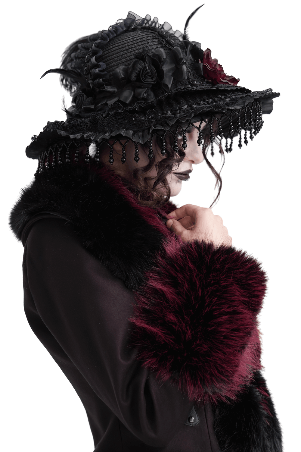 Stunning Victorian Gothic feather hat with lace and beaded trim, paired with a luxurious fur coat.