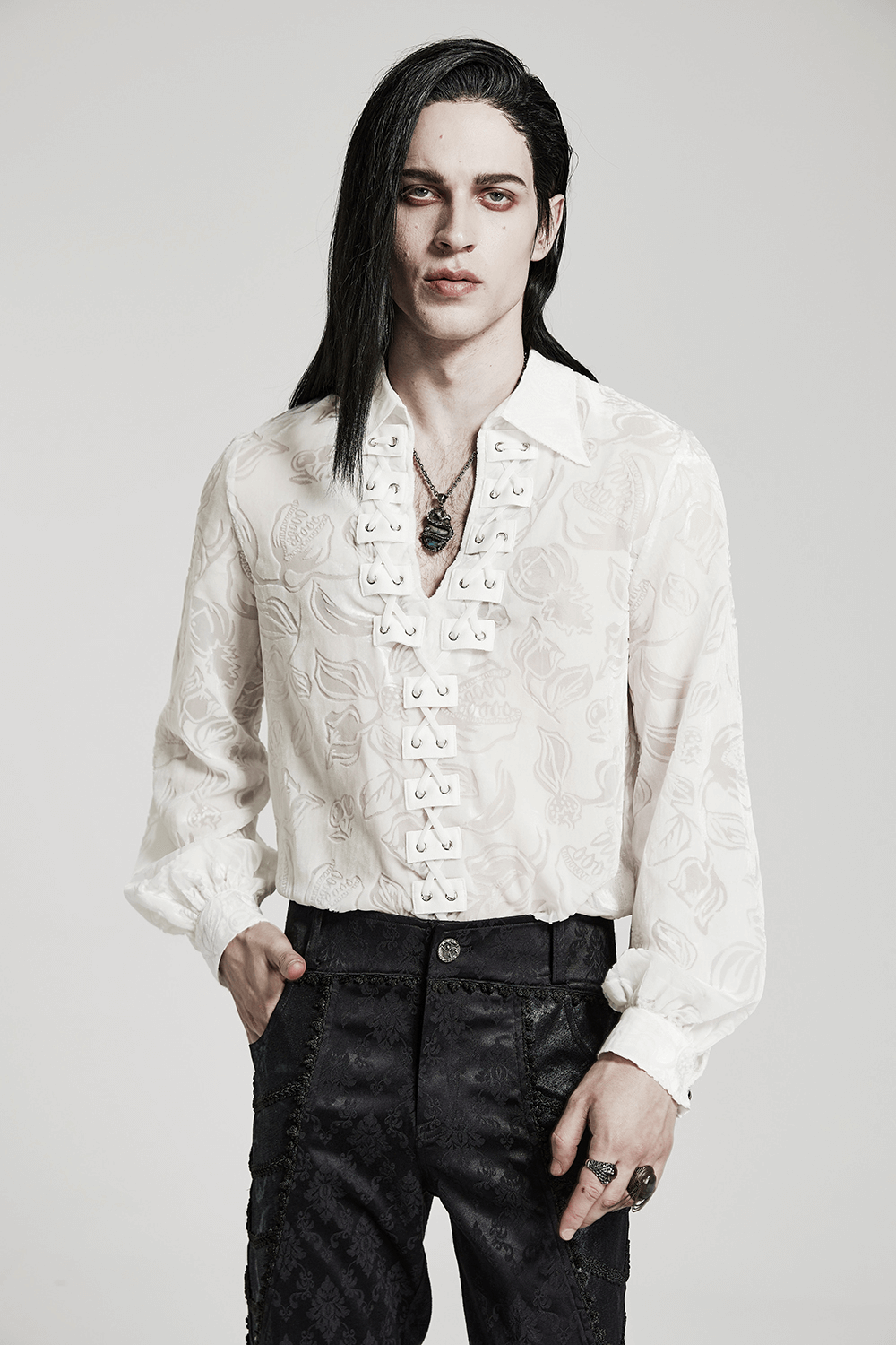 Model wearing a white Victorian Gothic velvet shirt with intricate detailing and a mysterious vibe.