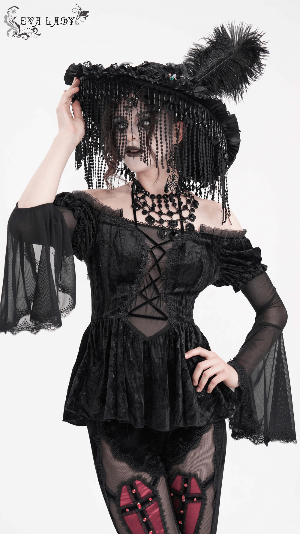 Elegant model in a Victorian Gothic hat with feathers and beads, wearing a black lace outfit. Perfect for dramatic style!